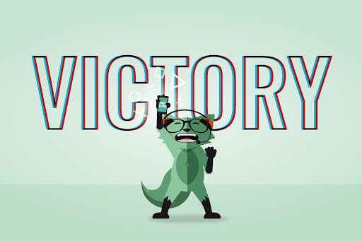 Mint fox holding his phone in the air saying Victory!